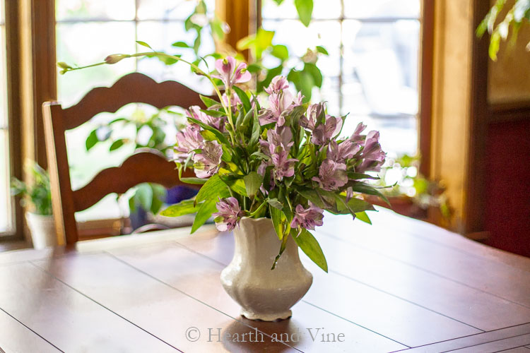 Vase with flower frog and alstroemeria flowers