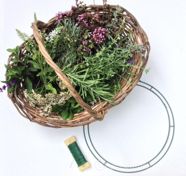 Basket of herbs and flowers, wire wreath frame and wire floral paddle.