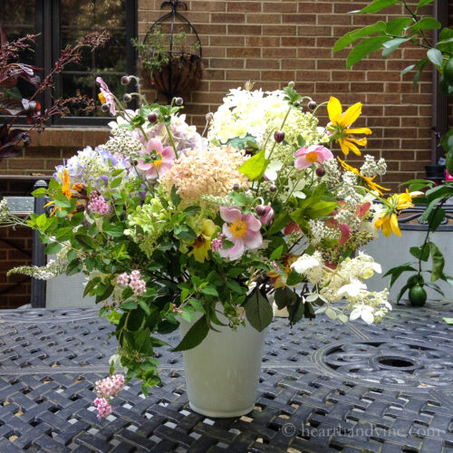 Cottage garden flowers in white vase