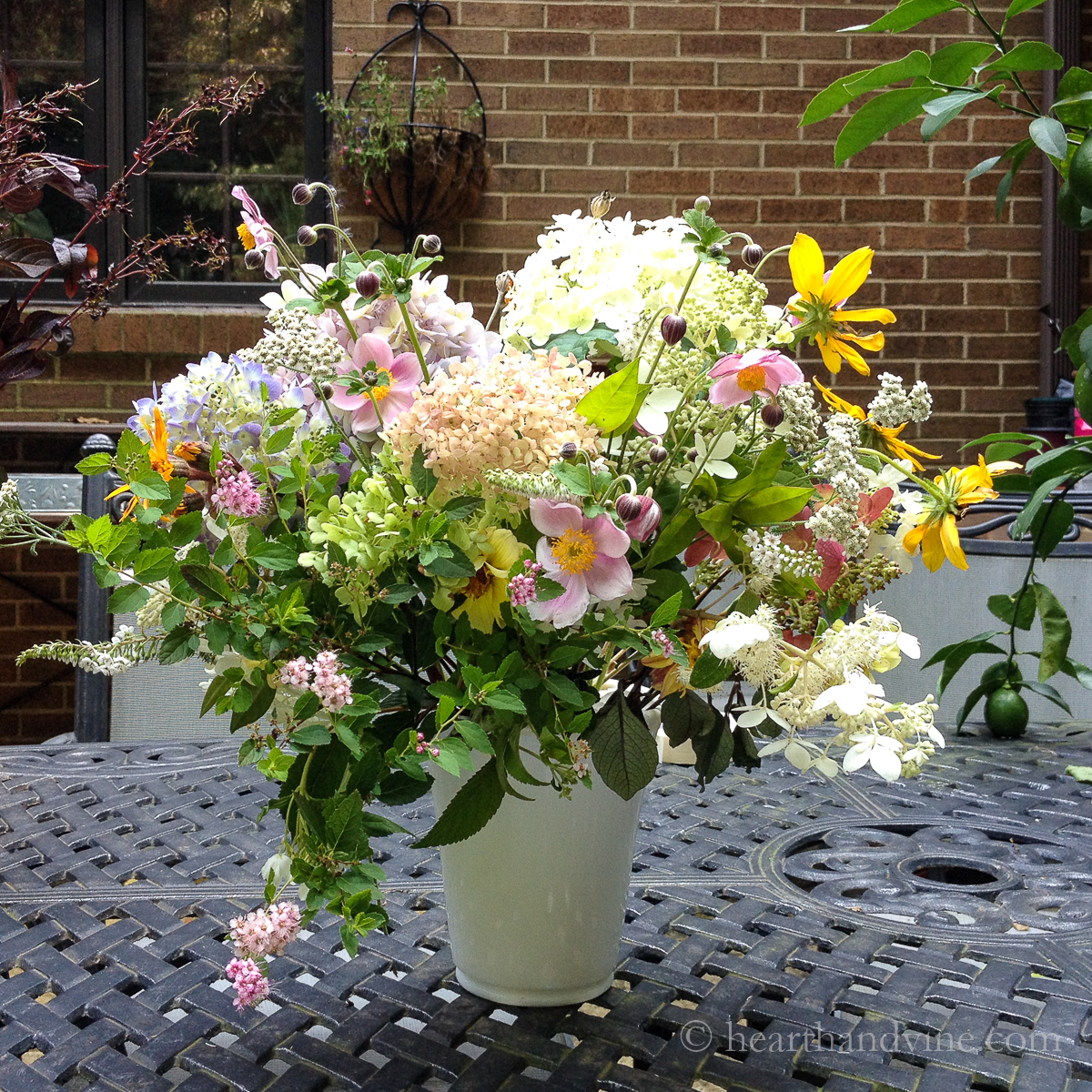 Cottage garden flowers in white vase