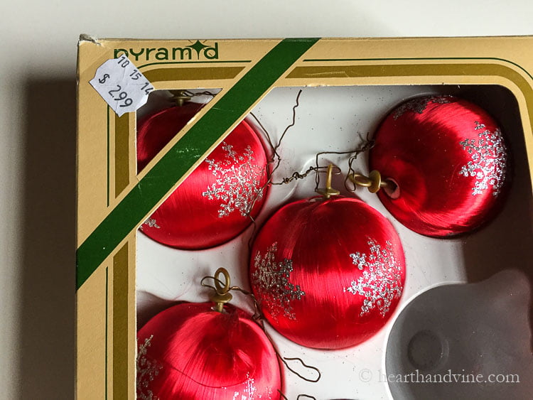 Box of red satin Goodwill ornaments