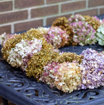 Square dried hydrangea wreath on a table.
