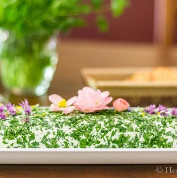 Herbed cheese spread with edible flowers