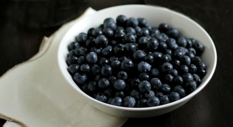 Bowl of blueberries for flag fruit tart