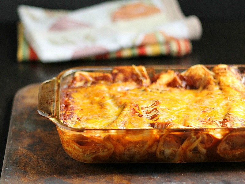 Baking dish with chicken enchiladas