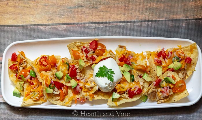 Tray of low acid tomato chicken nachos