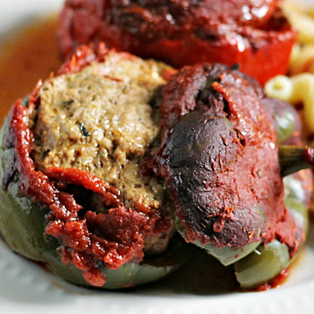 Meatball filling stuffed green pepper close up.