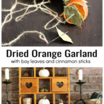 Dried orange, bay leaf and cinnamon garland over the garland hanging on a mantel.