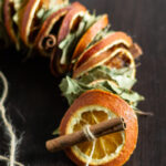 Dried orange garland on twine with bay leaves and cinnamon sticks.