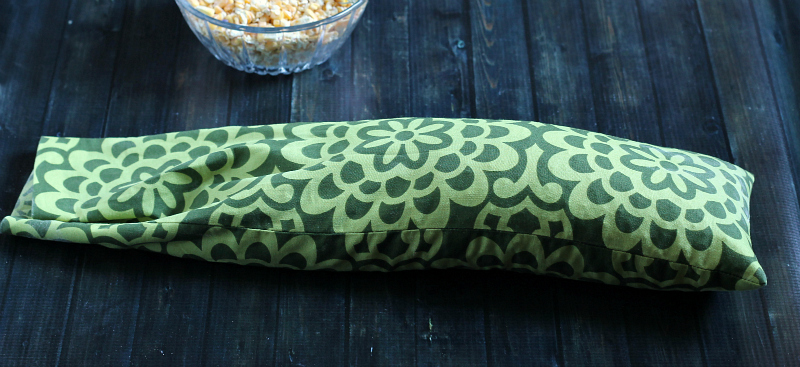Stuffing fabric bag with cracked corn