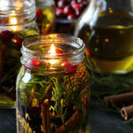 Mason jar oil candle with cinnamon sticks, cedar and other botanicals.