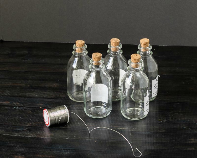 Glass bottles and wire for bottle garland