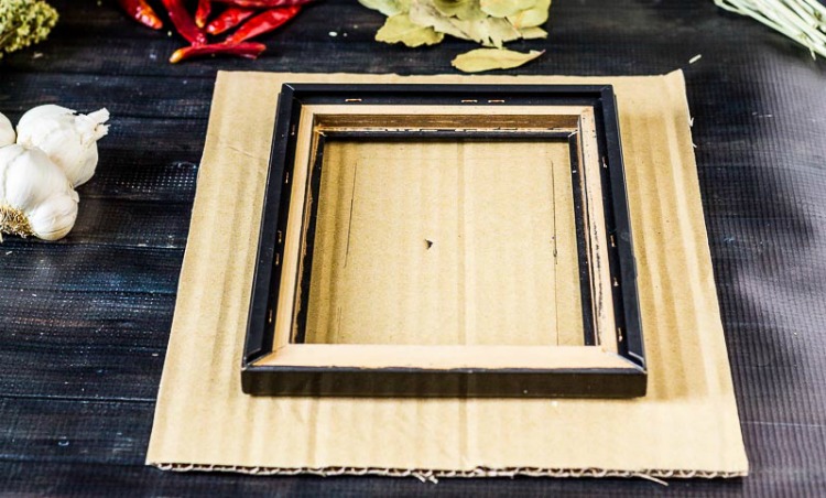 Cardboard under picture frame