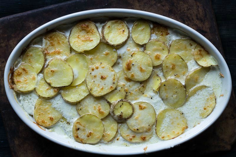 Scalloped potatoes baked in dish