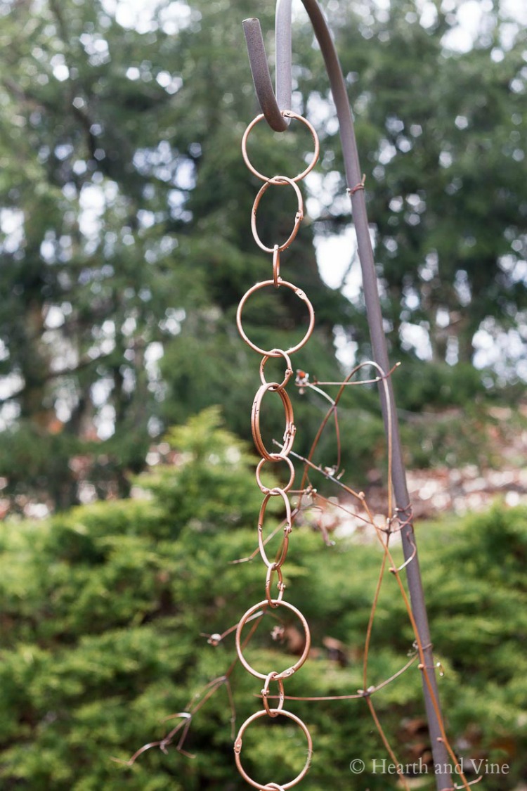 Handmade copper rain chain on shepherd's hook