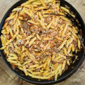 Spaghetti casserole in a large skillet.