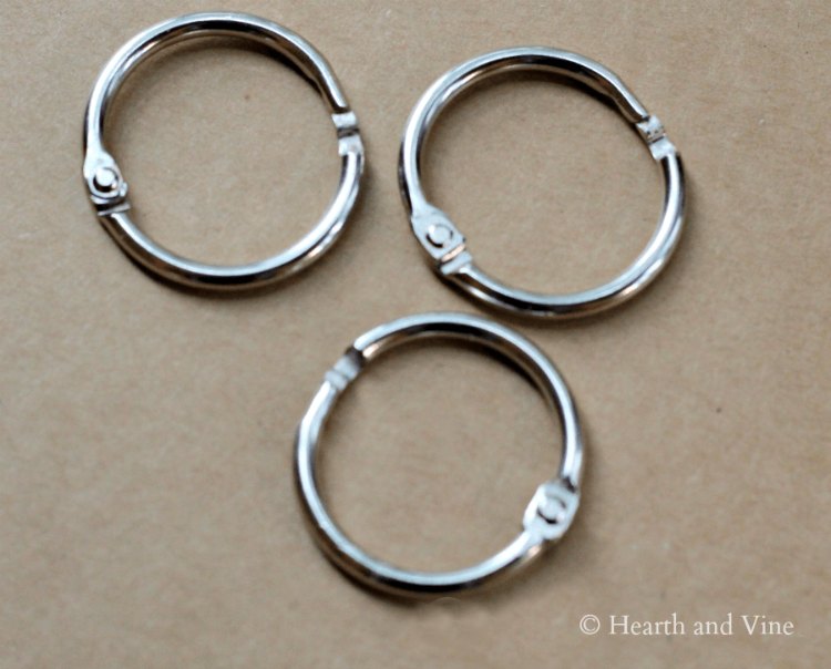 Three silver binder rings