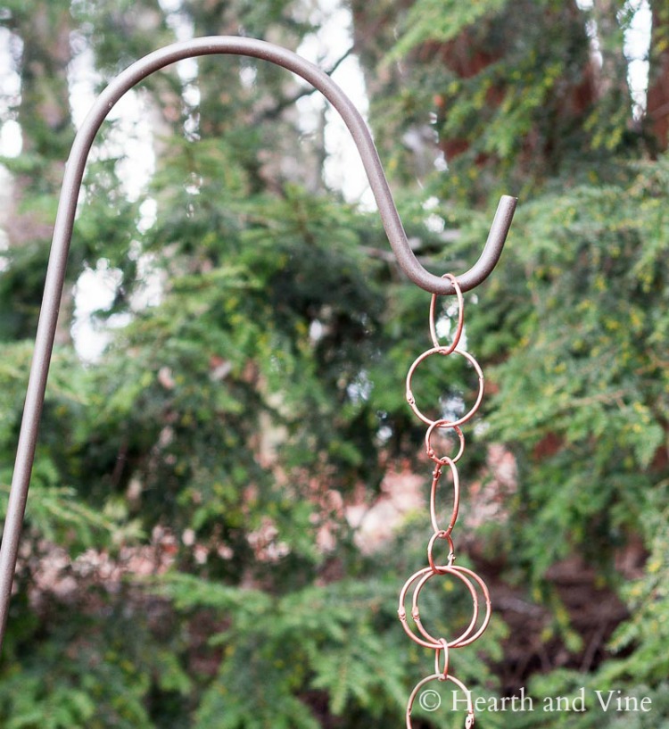 Copper rain chain on a shepherd's hook
