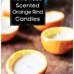 Several orange peel candles on a table.