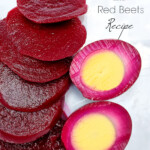 Sliced of red beets next to a pickled red beet egg sliced in half.