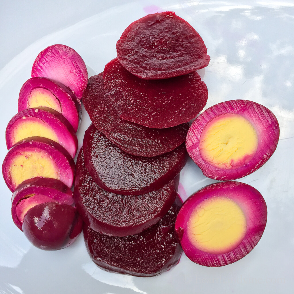 Sliced pickled beet eggs and beets.