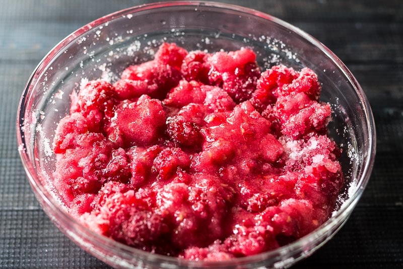 Berries and sugar in a bowl.