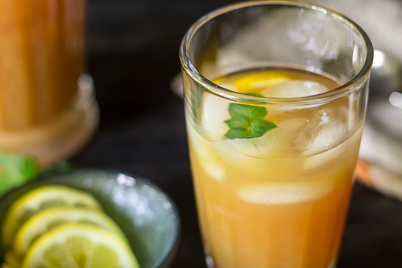 Glass of Fruit Tea punch with lemon and mint 