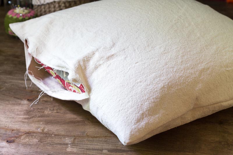 Open end of pillow case made from drop cloth material.