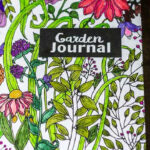 Colorful garden journal cover on a composition book.