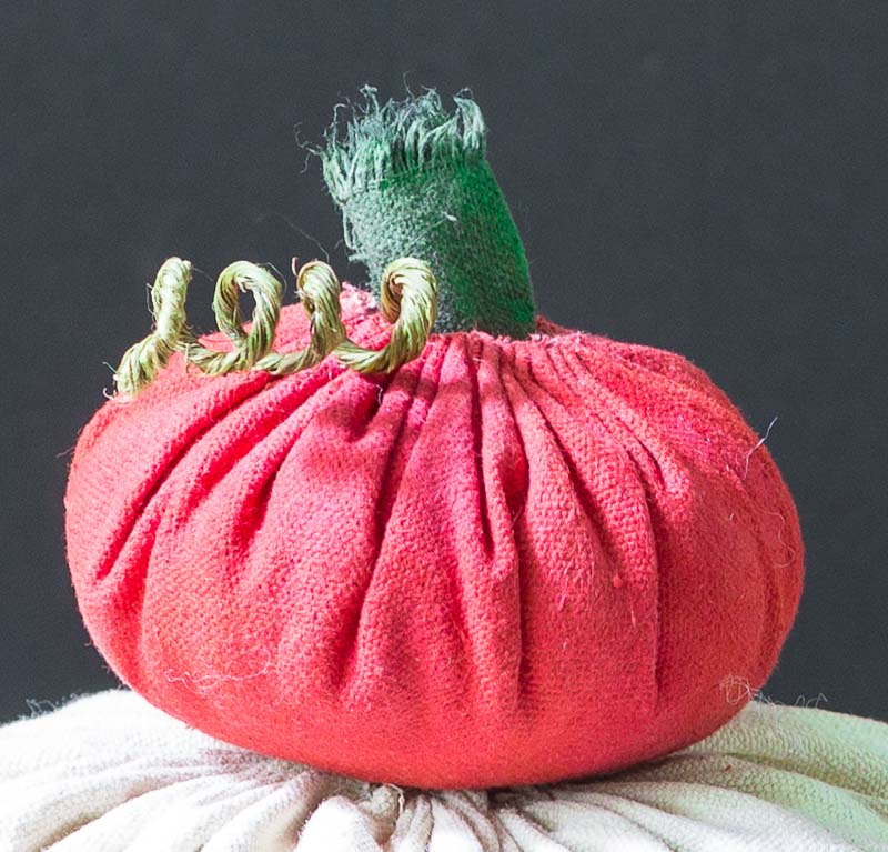 Small red fabric pumpkin with stem