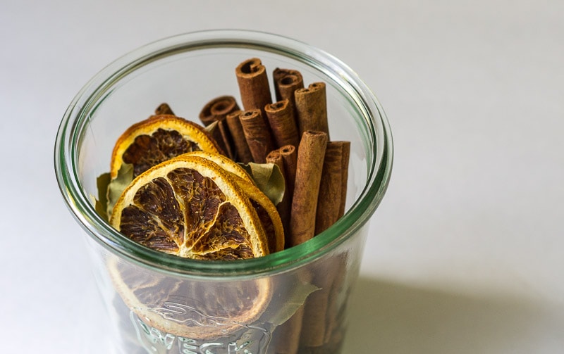 Top of jar with orange slices and cinnamon sticks