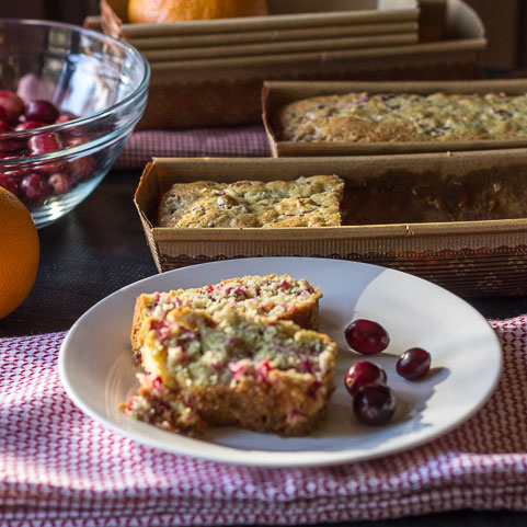 Sliced cranberry orange bread on a plate