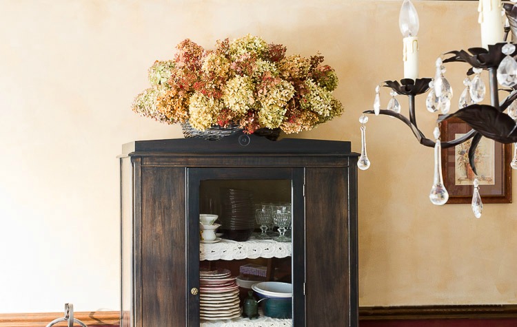 dried hydrangea basket on cabinet