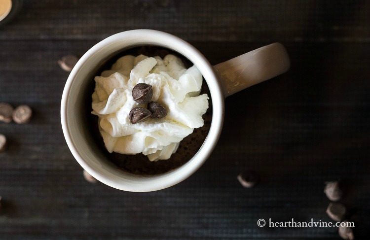 Mug cake in mug with whipped cream