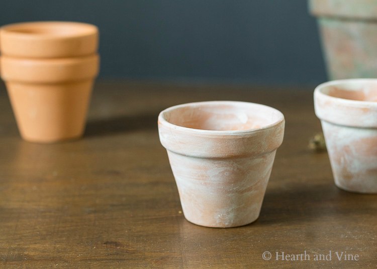 White washed little clay pots
