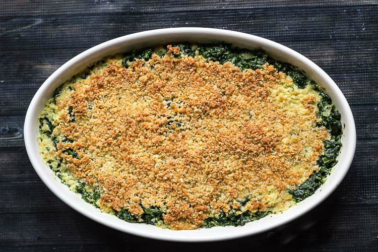 Spinach Casserole in an oval serving dish.