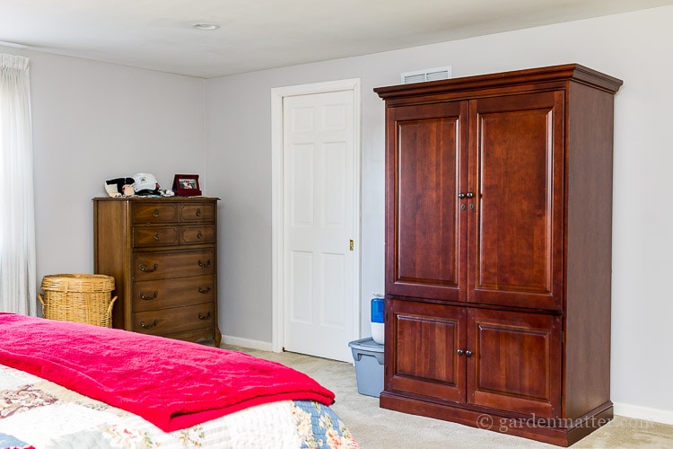 Armoire and tall dresser before view on the $100 room makeover challenge.