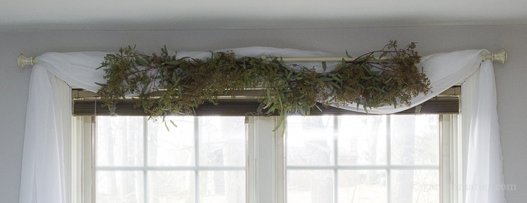 Fresh eucalyptus garland on bedroom window makeover