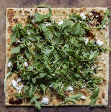 Arugula, goat cheese and fig balsamic drizzle flatbread.