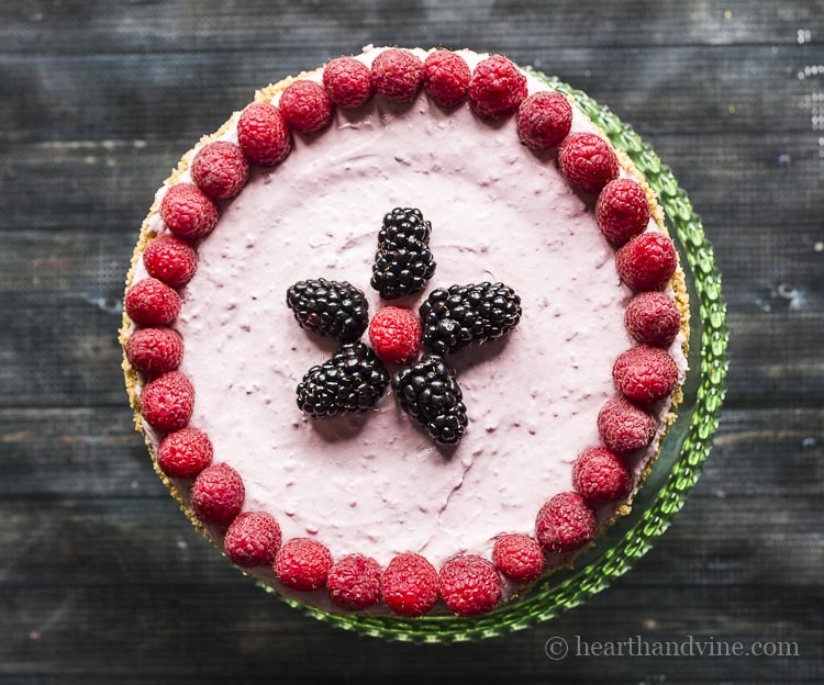 Top of low sugar cheesecake decorated with berries.