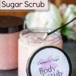 Two jars of homemade sugar scrub with pink flower label on lid.