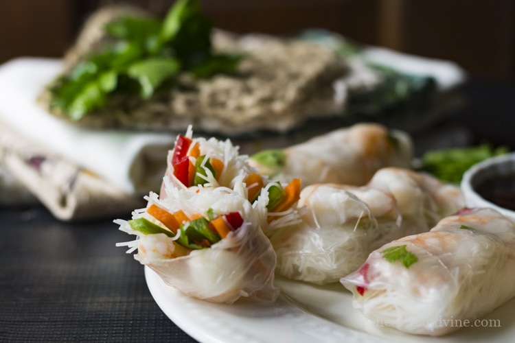 Shrimp spring roll appetizers with dipping sauce.