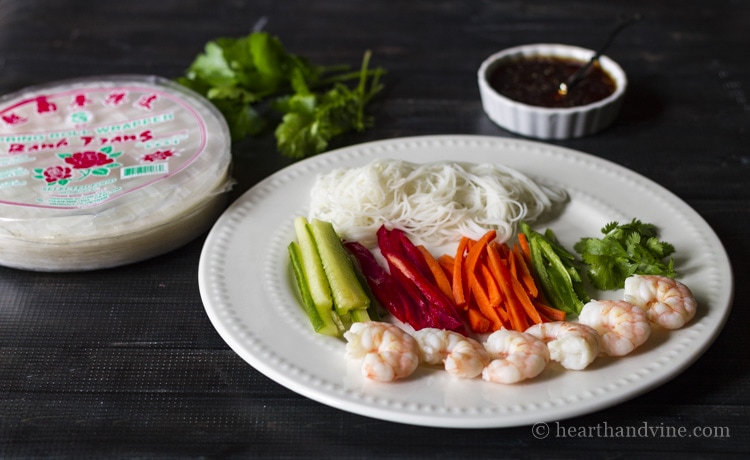 Fresh shrimp spring roll and dipping sauce ingredients.