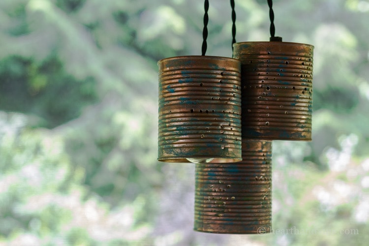Hanging tin can pendant lights during the day.