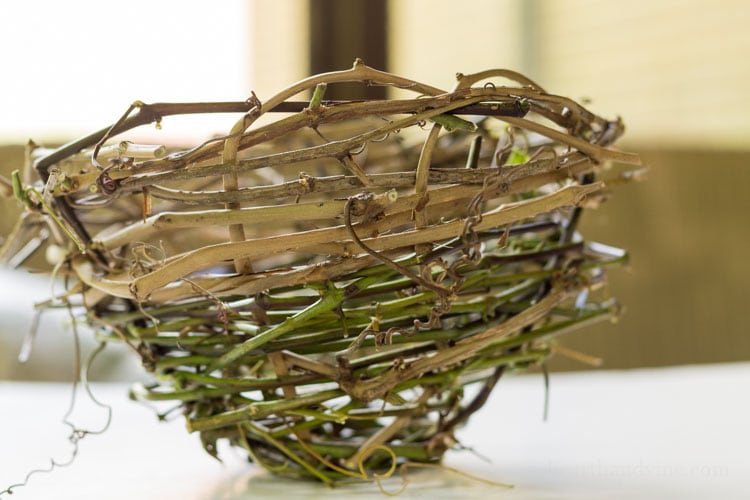 Side view of handmade grape vine basket.