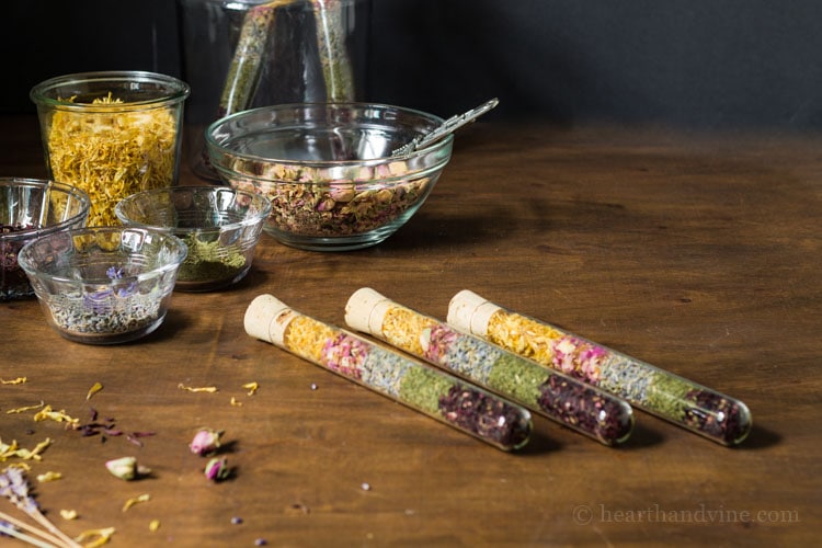Handmade gifts of dried flowers and herbs in test tubes.