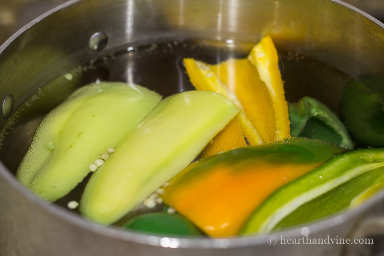 Peppers cooking in water