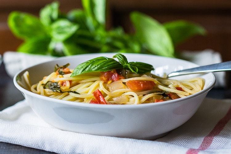 Fresh tomato basil pasta is easy, and a good way to use fresh tomatoes and basil from the garden. It's so delicious you'll want to make it every night.