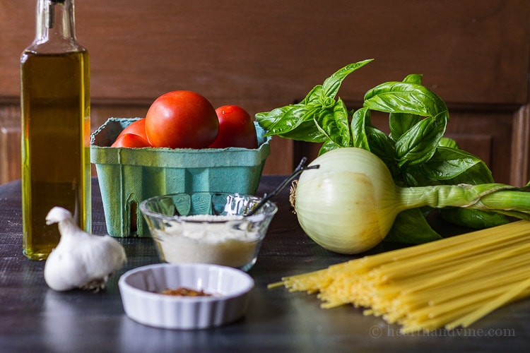 Fresh tomato basil pasta ingredients. An easy way to use fresh tomatoes and basil from the garden. It's so delicious you'll want to make it every night.