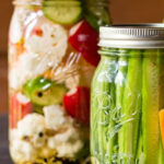 Quart jar and pint mason jar of refrigerator pickled vegetables.